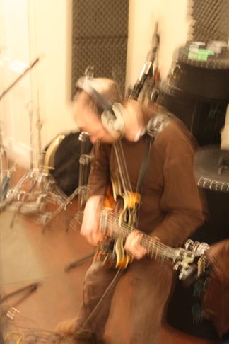 Photo: Jim thrashing out the guitar parts.
